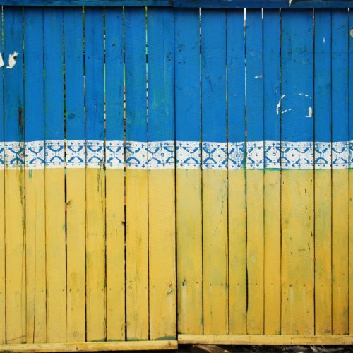 yellow and blue wooden fence